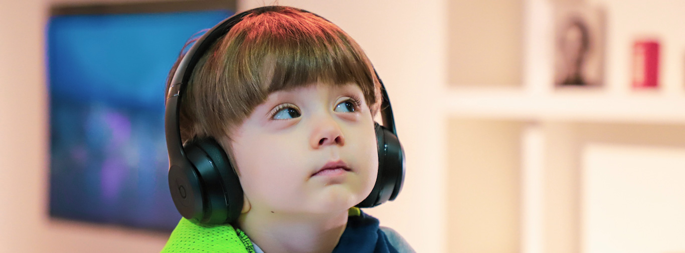 Boy looking away wearing headphones